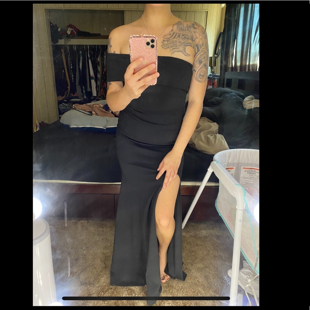 Brand new. Long black asymmetric formal slit dress